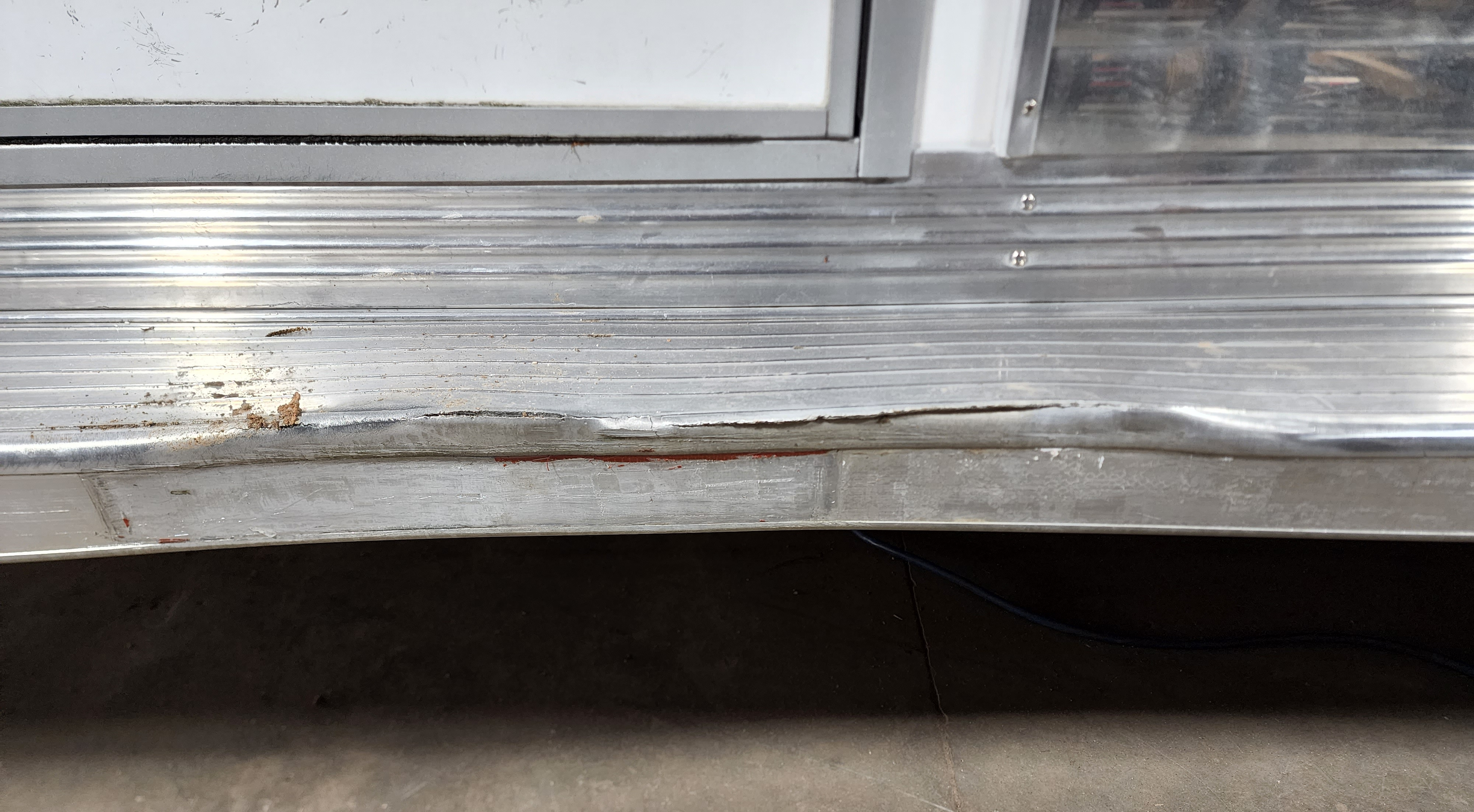 A trailer step bent in that can cause injuries to a horse or person.